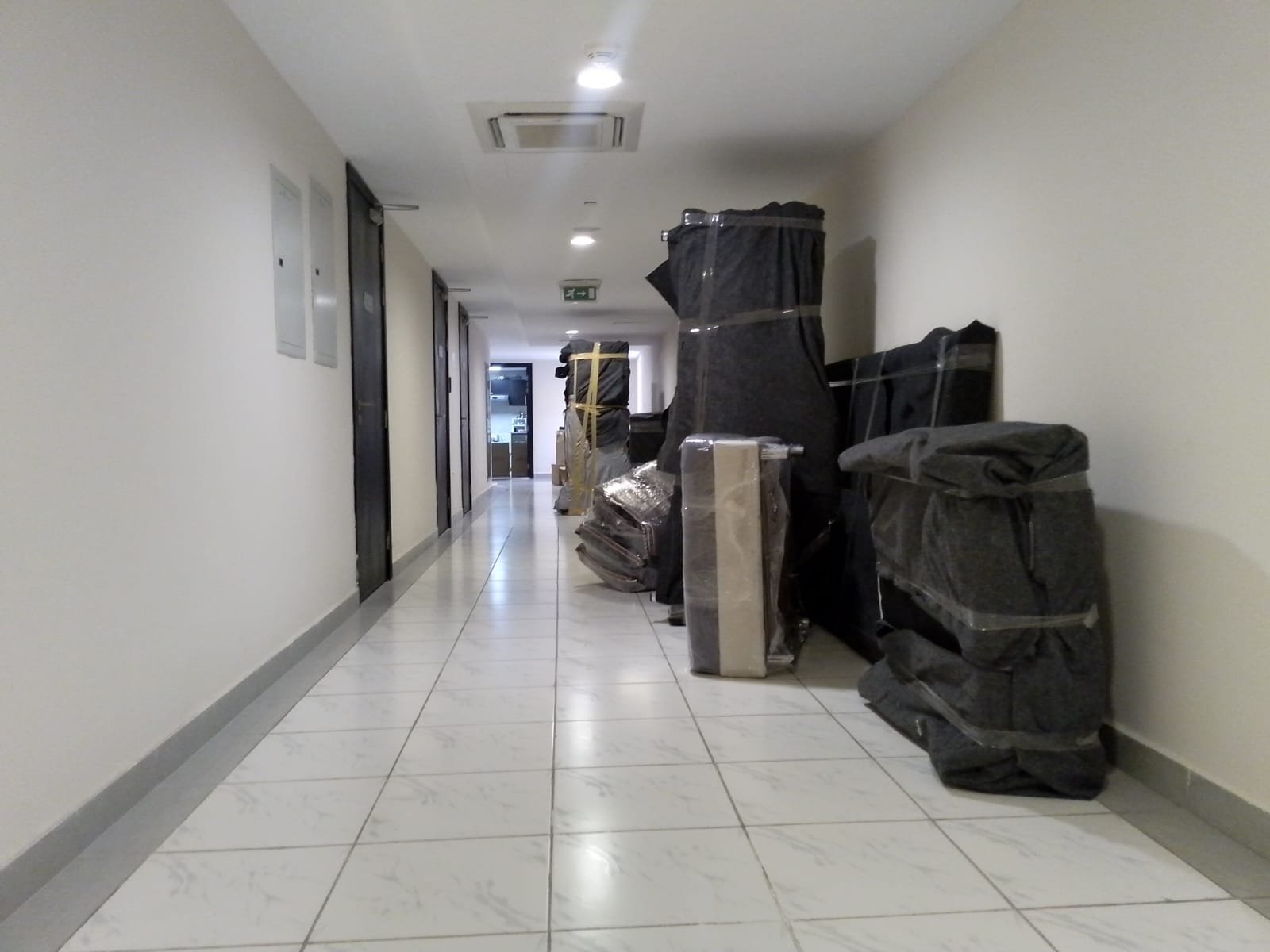 Professional house movers in Abu Dhabi loading a truck